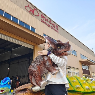Ein guter Preis. Handgesteuerte elektrische animatronische Baby-Dinosaurier-Armpuppe mit Dinosaurier-Gebrüll Online